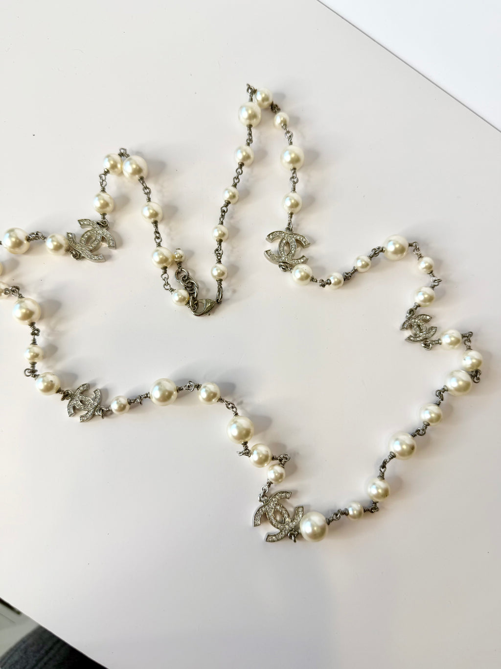 Chanel 5 motif crystal CC with pearl long strand