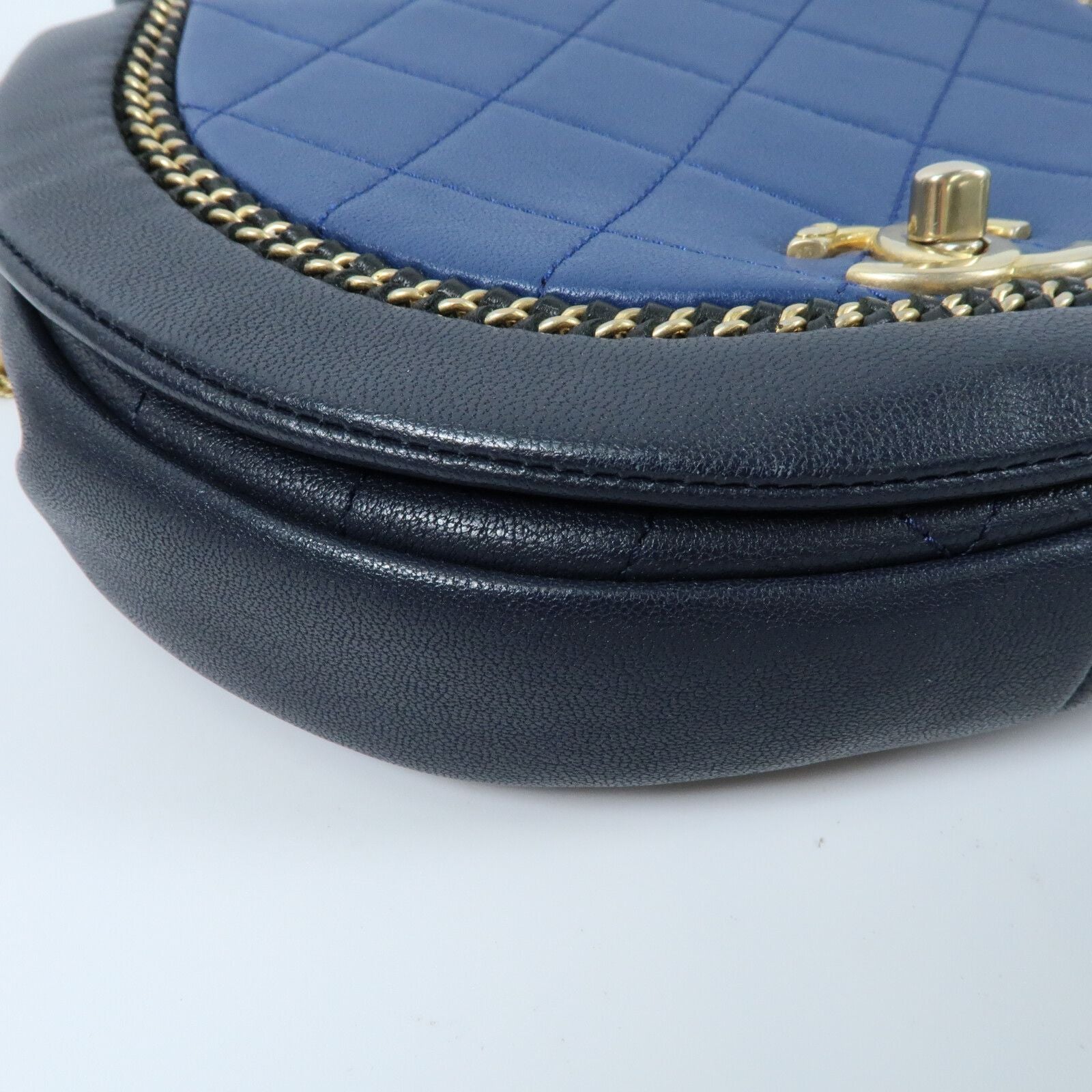 Chanel small quilted two-tone calfskin saddle bag with chain detail